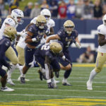 
              Tulsa running back Steven Anderson, right, runs with the ball against Navy during the first half of an NCAA college football game, Saturday, Oct. 8, 2022, in Annapolis, Md. (AP Photo/Julio Cortez)
            