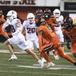 
              Washington State wide receiver Leyton Smithson runs after a catch in front of Oregon State defensive back Alex Austin (5) and linebacker Omar Speights (1) during the second half of an NCAA college football game Saturday, Oct. 15, 2022, in Corvallis, Ore. (AP Photo/Mark Ylen)
            