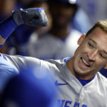 
              Kansas City Royals' Drew Waters celebrates in the dugout after hitting a three-run home run off Cleveland Guardians relief pitcher Kirk McCarty during the 10th inning of a baseball game, Monday, Oct. 3, 2022, in Cleveland. (AP Photo/Ron Schwane)
            