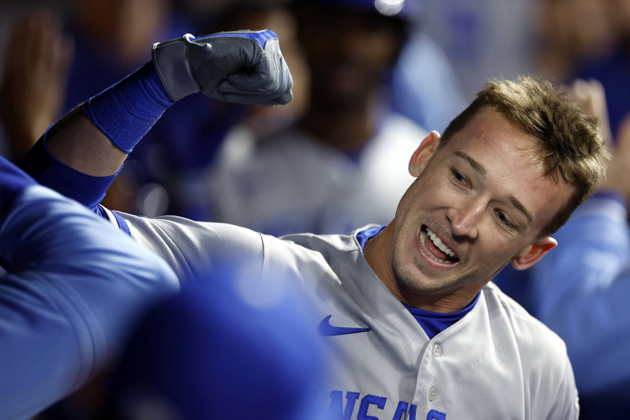 Kansas City Royals' Drew Waters celebrates in the dugout after hitting a three-run home run off Cle...