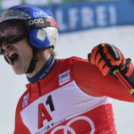 
              Switzerland's Marco Odermatt reacts after crossing the finish line to win an alpine ski, men's World Cup giant slalom, in Soelden, Austria, Sunday, Oct. 23, 2022. (AP Photo/Marco Trovati)
            
