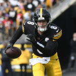 
              Pittsburgh Steelers quarterback Kenny Pickett scrambles during the first half of an NFL football game against the Tampa Bay Buccaneers in Pittsburgh, Sunday, Oct. 16, 2022. (AP Photo/Don Wright)
            