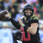
              Oregon's Bo Nix throws down field against UCLA during the first half in an NCAA college football game Saturday, Oct. 22, 2022, in Eugene, Ore. (AP Photo/Chris Pietsch)
            