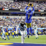 
              Los Angeles Rams wide receiver Allen Robinson II (1) makes a touchdown catch over Carolina Panthers cornerback Donte Jackson (26) during the first half of an NFL football game Sunday, Oct. 16, 2022, in Inglewood, Calif. (AP Photo/Ashley Landis)
            