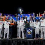 
              The Houston Astros celebrate with the American League Championship trophy after defeating the New York Yankees in Game 4 to win the American League Championship baseball series, Monday, Oct. 24, 2022, in New York. (AP Photo/John Minchillo)
            