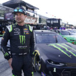 
              FILE - Kurt Busch walks in the pits before qualifications for the NASCAR Series auto race at Indianapolis Motor Speedway, Sunday, Aug. 15, 2021, in Indianapolis. Busch announced Saturday, Oct. 15, 2022  he will miss the rest of this season with a concussion and will not compete full-time in 2023.  The 44-year-old made his announcement at Las Vegas Motor Speedway, his home track and where he launched his career on the bullring as a child. He choked up when he said doctors told him “it is best for me to ‘shut it down.'”  (AP Photo/Darron Cummings, File)
            
