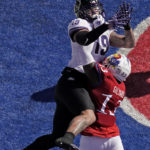
              Kansas linebacker Eriq Gilyard (13) breaks up a pass intended for TCU tight end Jared Wiley (19) during the first half of an NCAA college football game Saturday, Oct. 8, 2022, in Lawrence, Kan. (AP Photo/Charlie Riedel)
            