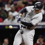 
              New York Yankees' Anthony Rizzo hits an RBI-single in the first inning of Game 4 of a baseball AL Division Series against the Cleveland Guardians, Sunday, Oct. 16, 2022, in Cleveland. (AP Photo/David Dermer)
            