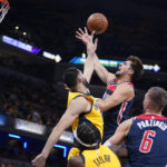 
              Washington Wizards' Deni Avdija shoots over Indiana Pacers' Goga Bitadze during the first half of an NBA basketball game Wednesday, Oct. 19, 2022, in Indianapolis. (AP Photo/Michael Conroy)
            