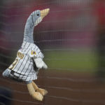 
              A stuffed toy goose is hanging on the net during the ninth inning in Game 1 of the baseball NL Championship Series between the San Diego Padres and the Philadelphia Phillies on Tuesday, Oct. 18, 2022, in San Diego. (AP Photo/Gregory Bull)
            