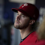 
              Philadelphia Phillies starting pitcher Aaron Nola sits in the dugout during the sixth inning in Game 2 of the baseball NL Championship Series between the San Diego Padres and the Philadelphia Phillies on Wednesday, Oct. 19, 2022, in San Diego. (AP Photo/Gregory Bull)
            