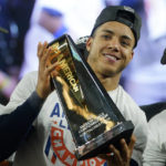 
              Houston Astros shortstop Jeremy Pena (3) holds up the ALCS Most Valuable Player trophy after the Astros defeated the New York Yankees 6-5 in Game 4 of an American League Championship baseball series, Monday, Oct. 24, 2022, in New York. (AP Photo/John Minchillo)
            