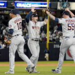 
              Houston Astros first baseman Yuli Gurriel, Alex Bregman and relief pitcher Ryan Pressly (55) celebrate after the Astros defeated the New York Yankees 6-5 to win Game 4 and the American League Championship baseball series, Monday, Oct. 24, 2022, in New York. (AP Photo/John Minchillo)
            