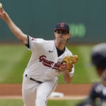 
              Cleveland Guardians' Shane Bieber pitches in the first innning of a wild card baseball playoff game against the Tampa Bay Rays, Friday, Oct. 7, 2022, in Cleveland. (AP Photo/Sue Ogrocki)
            