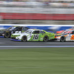 
              AJ Allmendinger (16), Ty Gibbs (54) and Noah Gragson (9) drive back to a restart during a NASCAR Xfinity auto race at Charlotte Motor Speedway on Saturday, Oct. 8, 2022, in Concord, N.C. (AP Photo/Matt Kelley)
            