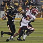
              Southern Mississippi defensive back Camron Harrell (29) makes a tackle against Louisiana Lafayette wide receiver Dontae Fleming (17) as Eric Scott Jr. (2) comes into assist during an NCAA college football game, Thursday, Oct. 27, 2022 at M.M. Roberts Stadium in Hattiesburg, Miss. (Hunter Dawkins/The Gazebo Gazette via AP)
            