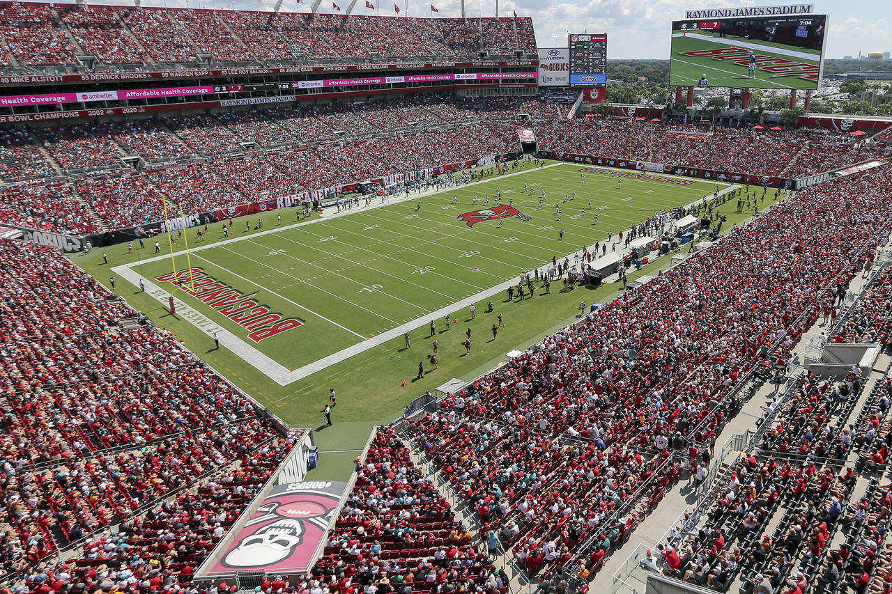 FILE - The Miami Dolphins and Tampa Bay Buccaneers play an NFL football game at Raymond James Stadi...