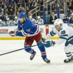 
              San Jose Sharks right wing Timo Meier (28) fights for control of the puck against New York Rangers left wing Alexis Lafreniere (13) during the first period of an NHL hockey game, Thursday, Oct. 20, 2022, in New York. (AP Photo/Eduardo Munoz Alvarez)
            