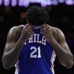 
              Philadelphia 76ers' Joel Embiid wipes his face during the first half of an NBA basketball game against the Indiana Pacers, Monday, Oct. 24, 2022, in Philadelphia. (AP Photo/Matt Slocum)
            