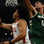 
              Houston Rockets' Daishen Nix shoots past Milwaukee Bucks' Brook Lopez during the first half of an NBA basketball game Saturday, Oct. 22, 2022, in Milwaukee. (AP Photo/Morry Gash)
            
