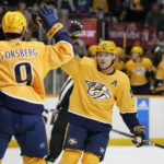 
              Nashville Predators' Mikael Granlund (64) congratulates Filip Forsberg (9) after Forsberg scored against the Los Angeles Kings in the second period of an NHL hockey game Tuesday, Oct. 18, 2022, in Nashville, Tenn. (AP Photo/Mark Humphrey)
            