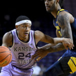
              FILE -Kansas State guard Nijel Pack (24) drives around West Virginia forward Isaiah Cottrell (13) during the first half of an NCAA college basketball game in Manhattan, Kan., Monday, Feb. 14, 2022. Pack, a 6-footer who earned first-team all-Big 12 honors last season and was named the conference’s most improved player. (AP Photo/Reed Hoffmann, File)
            