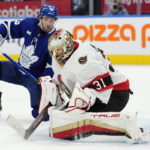 
              Ottawa Senators goaltender Anton Forsberg (31) is scored on by Toronto Maple Leafs' David Kampf, not seen, as Maple Leafs' Alexander Kerfoot (15) watches during the second period of an NHL hockey game Saturday, Oct. 15, 2022, in Toronto. (Frank Gunn/The Canadian Press via AP)
            