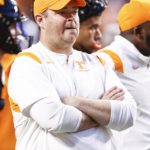 
              Tennessee head coach Josh Heupel watches as his team warms up before an NCAA college football game against Kentucky, Saturday, Oct. 29, 2022, in Knoxville, Tenn. (AP Photo/Wade Payne)
            
