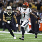 
              Cincinnati Bengals wide receiver Ja'Marr Chase (1) runs past New Orleans Saints linebacker Kaden Elliss (55) during the second half of an NFL football game in New Orleans, Sunday, Oct. 16, 2022. (AP Photo/Butch Dill)
            