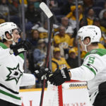 
              Dallas Stars left wing Mason Marchment (27) celebrates with defenseman Nils Lundkvist (5) after Marchment scored his second goal of the night against the Nashville Predators, during the first period of an NHL hockey game Thursday, Oct. 13, 2022, in Nashville, Tenn. (AP Photo/Mark Zaleski)
            