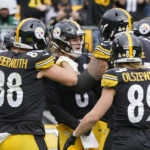 
              Pittsburgh Steelers quarterback Kenny Pickett (8), center, celebrates with teammates after scoring a touchdown against the New York Jets during the second half of an NFL football game, Sunday, Oct. 2, 2022, in Pittsburgh. (AP Photo/Gene J. Puskar)
            
