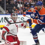 
              Carolina Hurricanes' Frederik Andersen (31) makes a save against Edmonton Oilers' Evander Kane (91) during second-period NHL hockey game action in Edmonton, Alberta, Thursday, Oct. 20, 2022. (Jason Franson/The Canadian Press via AP)
            