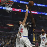 
              New Orleans Pelicans forward Zion Williamson drives to the basket against Los Angeles Clippers center Ivica Zubac during the first half of an NBA basketball game on Sunday, Oct. 30, 2022, in Los Angeles, Calif. (AP Photo/Allison Dinner)
            