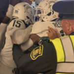 
              Security and police break up a scuffle between players from Michigan and Michigan State football teams in the Michigan Stadium tunnel after an NCAA college football game on Saturday, Oct. 29, 2022 in Ann Arbor, Mich.  Michigan State President Samuel Stanley has apologized and says the actions of the football players who were involved in a postgame melee with Michigan players are “unacceptable.” He also says the players involved would be held responsible by coach Mel Tucker.   (Kyle Austin/MLive Media Group via AP)
            