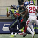 
              Seattle Seahawks wide receiver Tyler Lockett (16) reacts after an incomplete pass against New York Giants safety Xavier McKinney (29) and cornerback Adoree' Jackson during the second half of an NFL football game in Seattle, Sunday, Oct. 30, 2022. (AP Photo/Marcio Jose Sanchez)
            