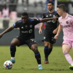 
              CF Montreal forward Sunusi Ibrahim controls the ball under pressure from Inter Miami defender Harvey Neville, in the second half of an MLS soccer game, Sunday, Oct. 9, 2022, in Fort Lauderdale, Fla. (AP Photo/Rebecca Blackwell)
            