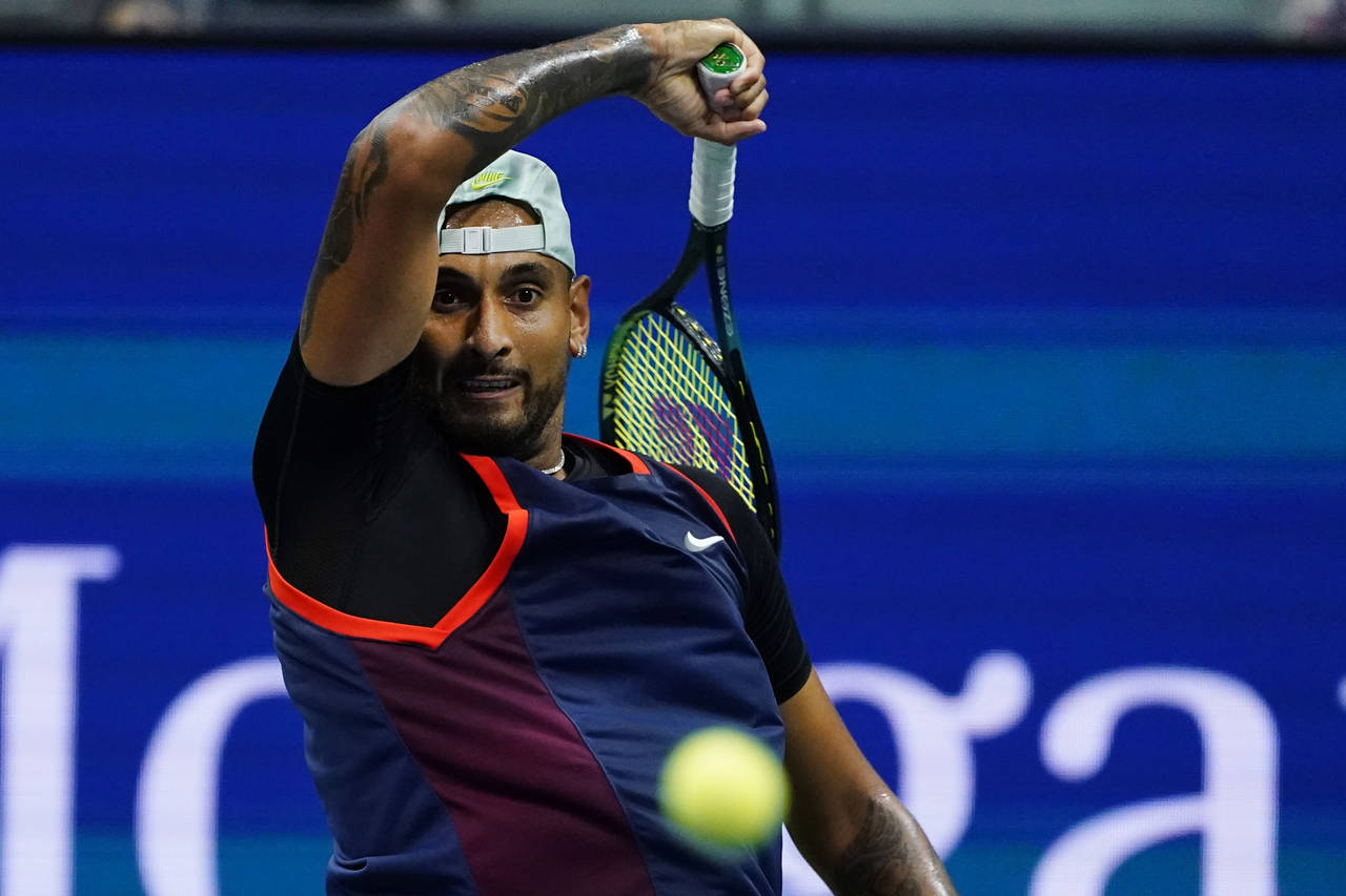 Nick Kyrgios, of Australia, returns to Karen Khachanov, of Russia, during the quarterfinals of the ...