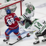 
              Montreal Canadiens' Mike Hoffman (68) scores on against Dallas Stars goaltender Jake Oettinger (29) as Stars' Jamie Benn (14) defends during first-period NHL hockey game action Saturday, Oct. 22, 2022, in Montreal. (Ryan Remiorz/The Canadian Press via AP)
            