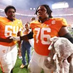 
              Tennessee offensive lineman Javontez Spraggins (76) holds a stuffed elephant as he celebrates with offensive lineman William Parker (64) after an NCAA college football game against Alabama, Saturday, Oct. 15, 2022, in Knoxville, Tenn. Tennessee won 52-49. (AP Photo/Wade Payne)
            