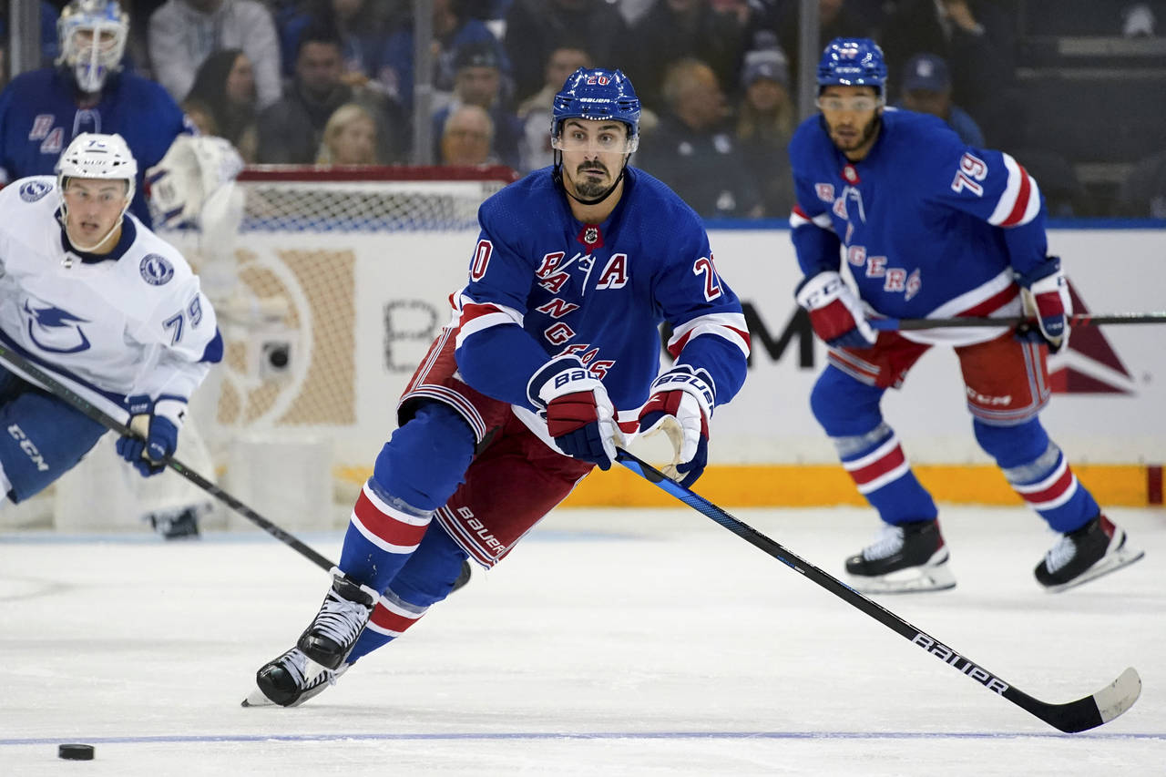 New York Rangers left wing Chris Kreider (20) skates toward the puck during the second period of th...