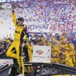
              Christopher Bell celebrates in Victory Lane after winning a NASCAR Cup Series auto race at Charlotte Motor Speedway, Sunday, Oct. 9, 2022, in Concord, N.C. (AP Photo/Matt Kelley)
            