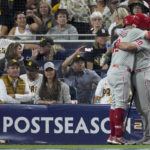 
              Philadelphia Phillies' Kyle Schwarber celebrates his home run with J.T. Realmuto during the sixth inning in Game 1 of the baseball NL Championship Series between the San Diego Padres and the Philadelphia Phillies on Tuesday, Oct. 18, 2022, in San Diego. (AP Photo/Ashley Landis)
            