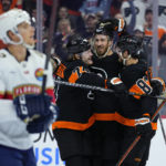 
              Philadelphia Flyers' Joel Farabee, from right, Kevin Hayes and Owen Tippett celebrate past Florida Panthers' Gustav Forsling after a goal by Farabee during the second period of an NHL hockey game, Thursday, Oct. 27, 2022, in Philadelphia. (AP Photo/Matt Slocum)
            