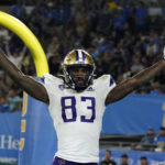
              Washington tight end Devin Culp celebrates his touchdown catch against UCLA during the second half of an NCAA college football game Friday, Sept. 30, 2022, in Pasadena, Calif. (AP Photo/Marcio Jose Sanchez)
            