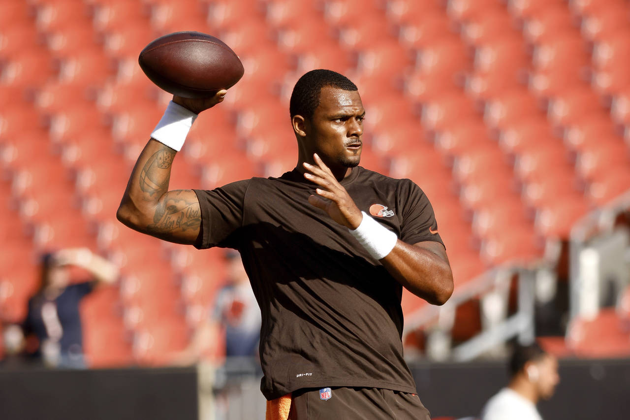 FILE - Cleveland Browns quarterback Deshaun Watson (4) warms up prior to an NFL preseason football ...