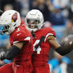 
              Arizona Cardinals safety Jalen Thompson (34) celebrates with safety Budda Baker after an interception against the Carolina Panthers during the first half of an NFL football game on Sunday, Oct. 2, 2022, in Charlotte, N.C. (AP Photo/Rusty Jones)
            