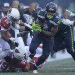 
              Seattle Seahawks running back Kenneth Walker III (9) runs against the Arizona Cardinals during the second half of an NFL football game in Seattle, Sunday, Oct. 16, 2022. (AP Photo/Caean Couto)
            