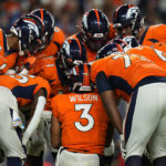 
              Denver Broncos quarterback Russell Wilson (3) huddles up his team during the second half of an NFL football game against the Indianapolis Colts, Thursday, Oct. 6, 2022, in Denver. (AP Photo/Jack Dempsey)
            