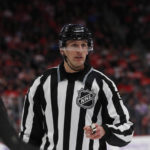 
              FILE - Linesman Ryan Daisy is seen during the second period of an NHL hockey game between the Detroit Red Wings and the Boston Bruins, Friday, Nov. 8, 2019, in Detroit. Daisy embraces the pressure of making important calls when games matter most. Being on water — frozen and otherwise — is Daisy’s comfort zone. (AP Photo/Carlos Osorio, File)
            