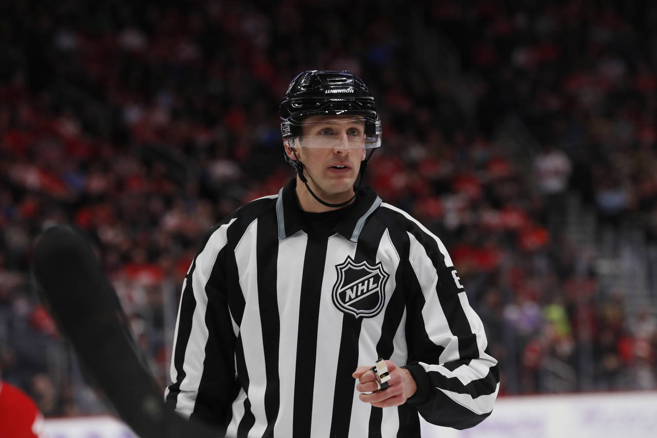 FILE - Linesman Ryan Daisy is seen during the second period of an NHL hockey game between the Detro...